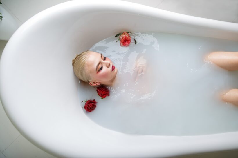 portrait of sexy girl in a bath with milk